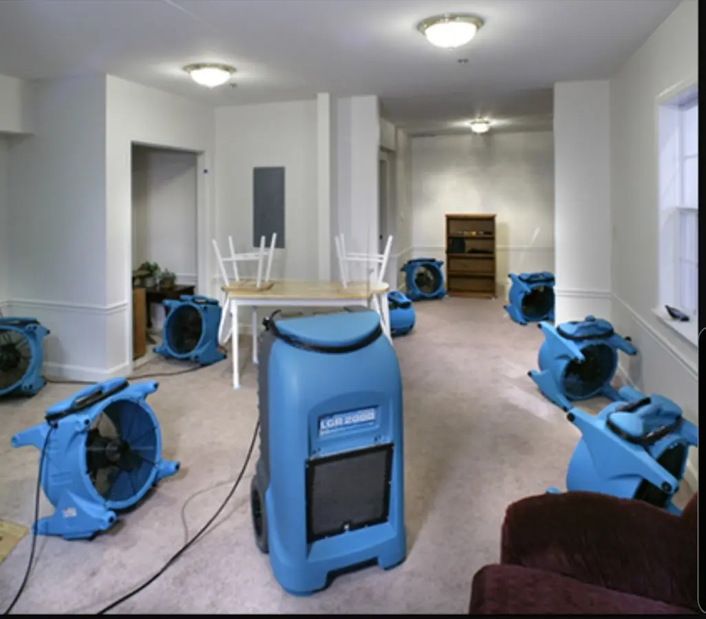 Air movers and dehumidifier setup for Water Damage Restoration in Glocester