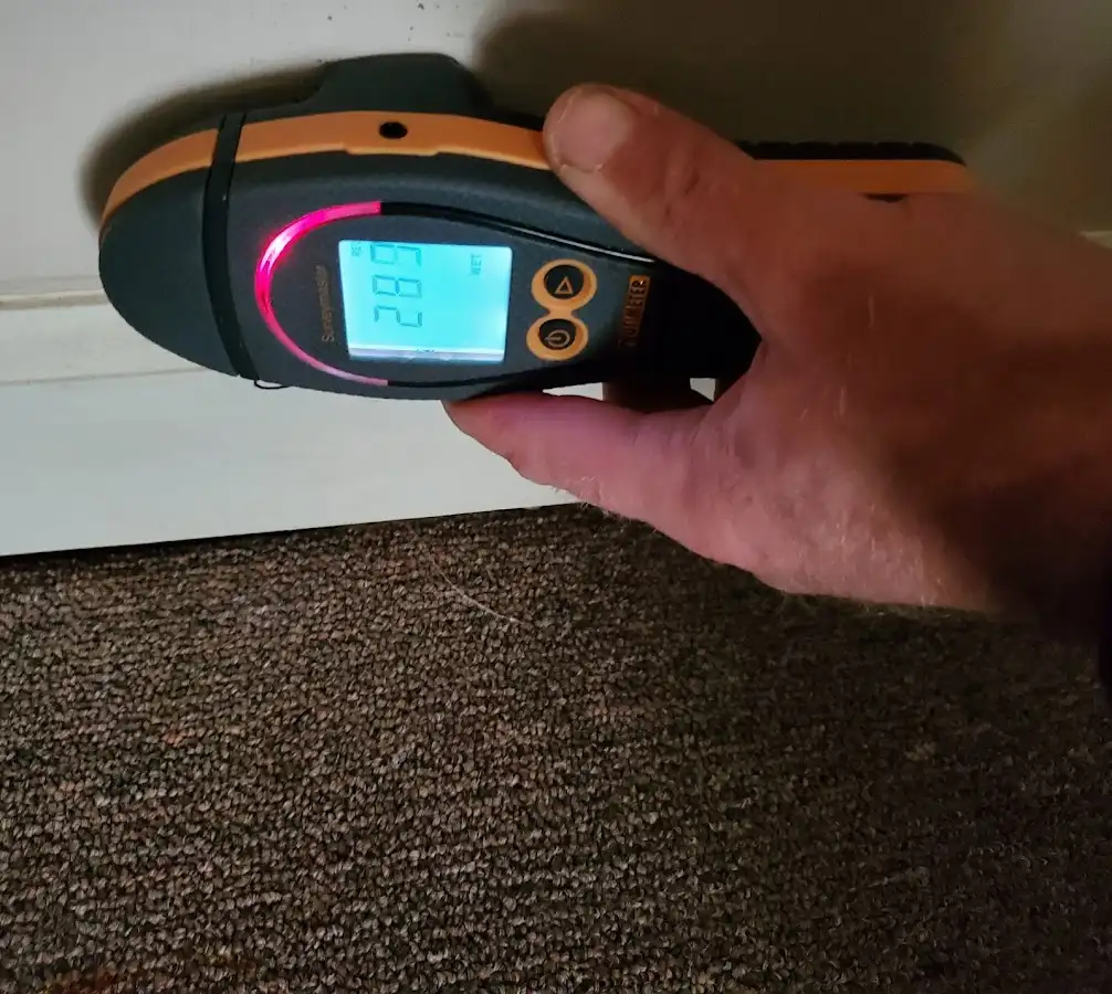 Moisture detection at baseboard during Burst Pipe Cleanup in Glocester